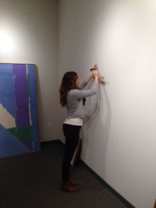Amanda installing works in The Maslow Gallery