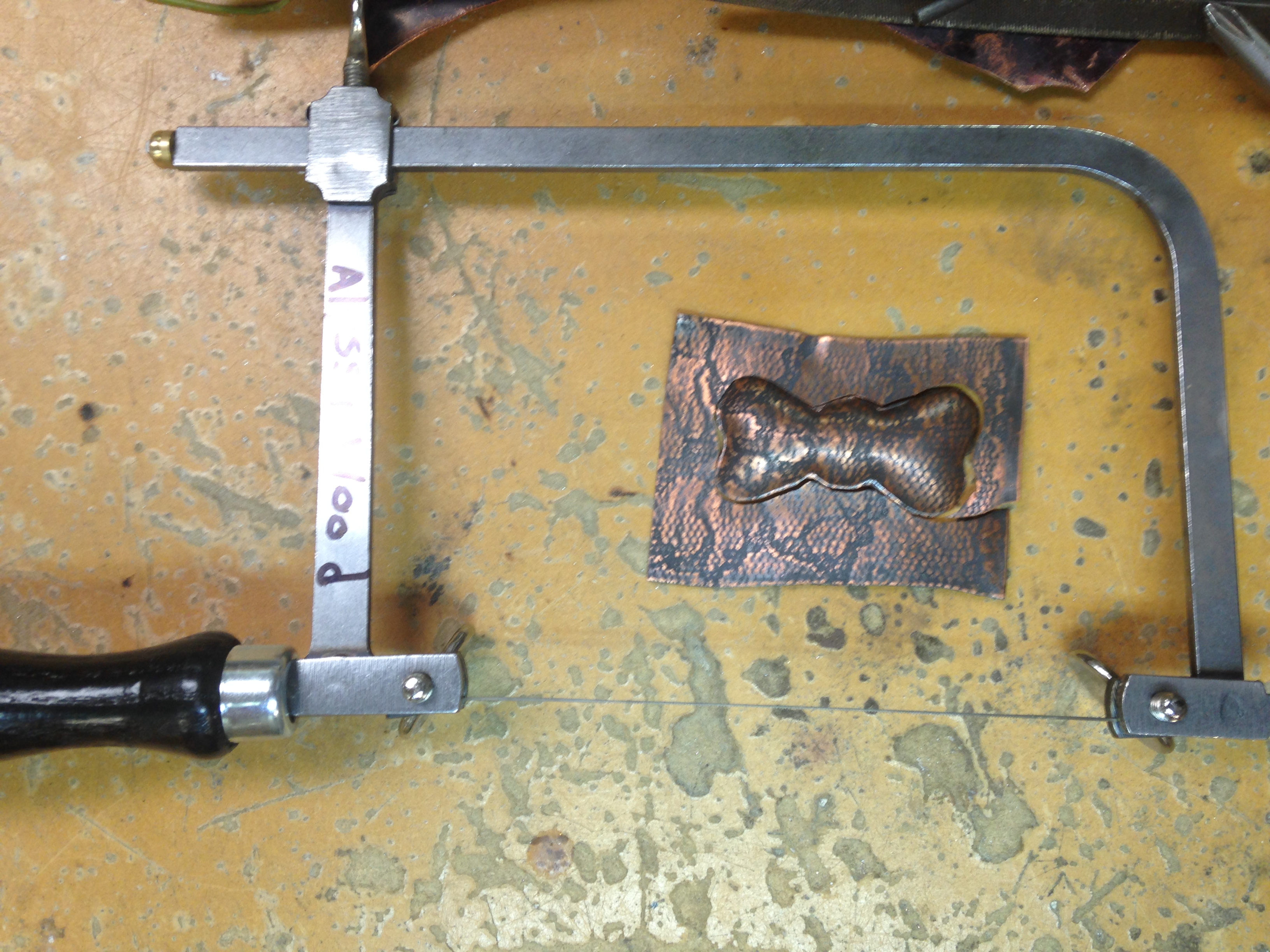 copper piece and saw