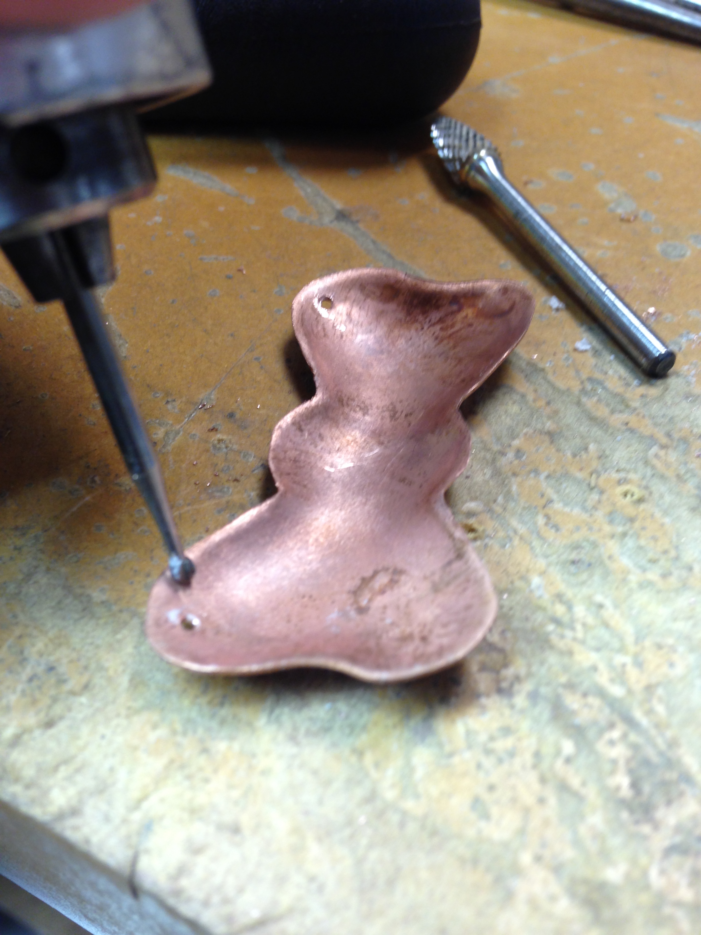 toucing up drill holes in metal bow