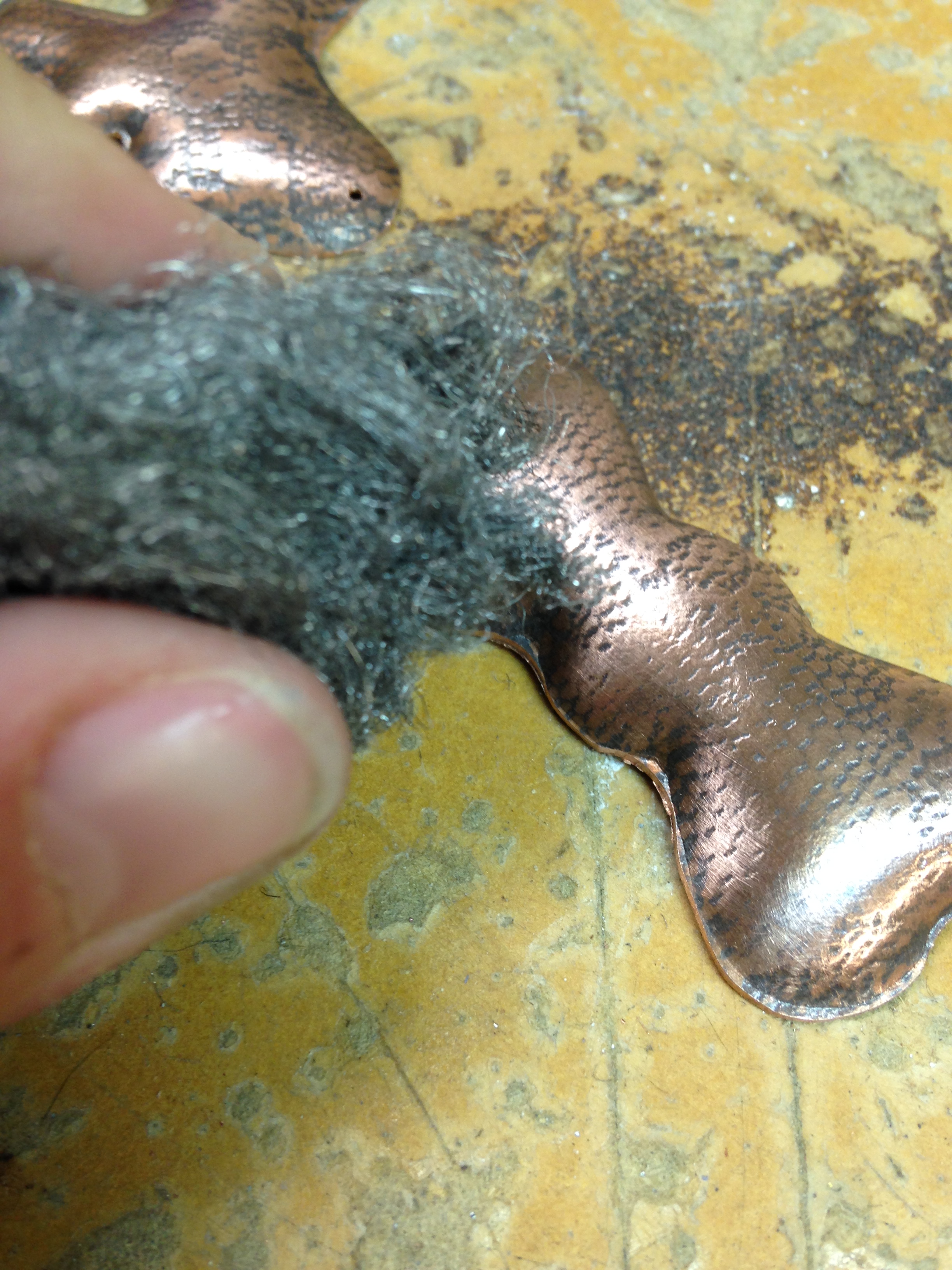 steel wool sanding copper bow