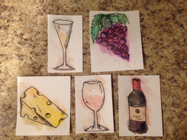 close up of watercolor pictures of wine glasses, cheese, wine bottle, and grapes
