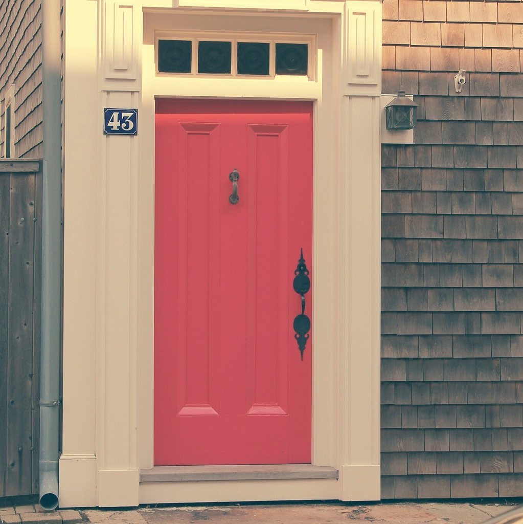 a house with a pink door
