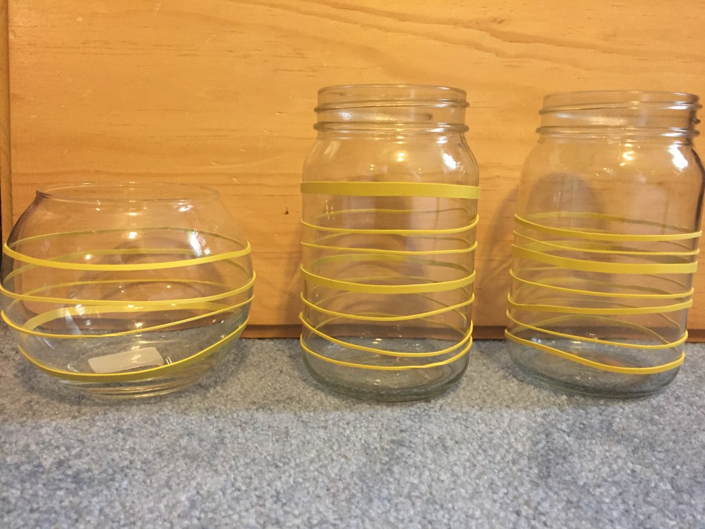 Rubber bands wrapped around the jars