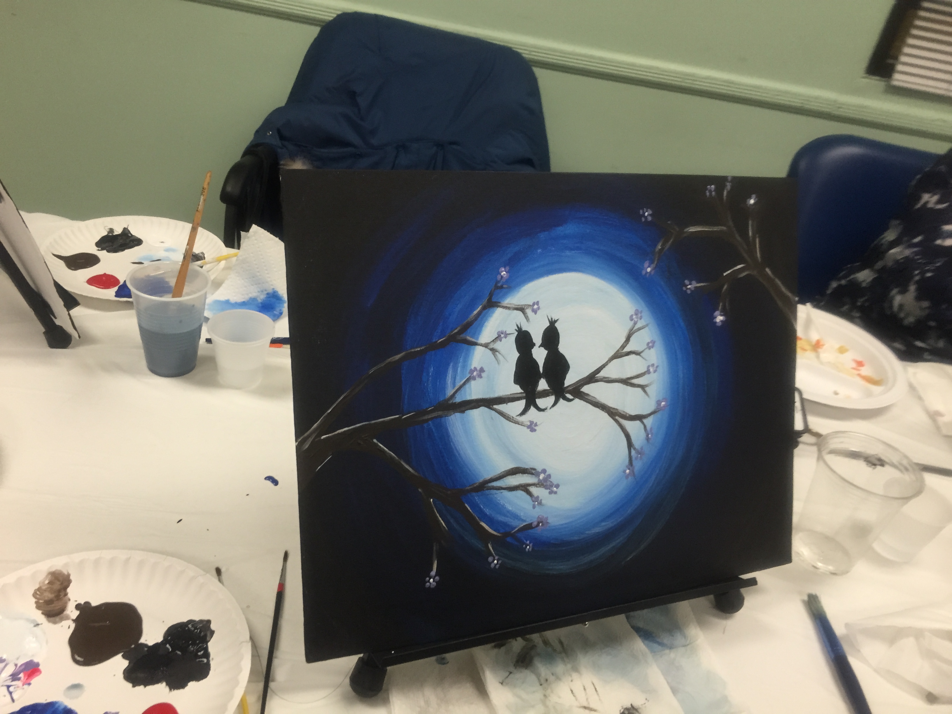 finished painting of two birds in the moonlight