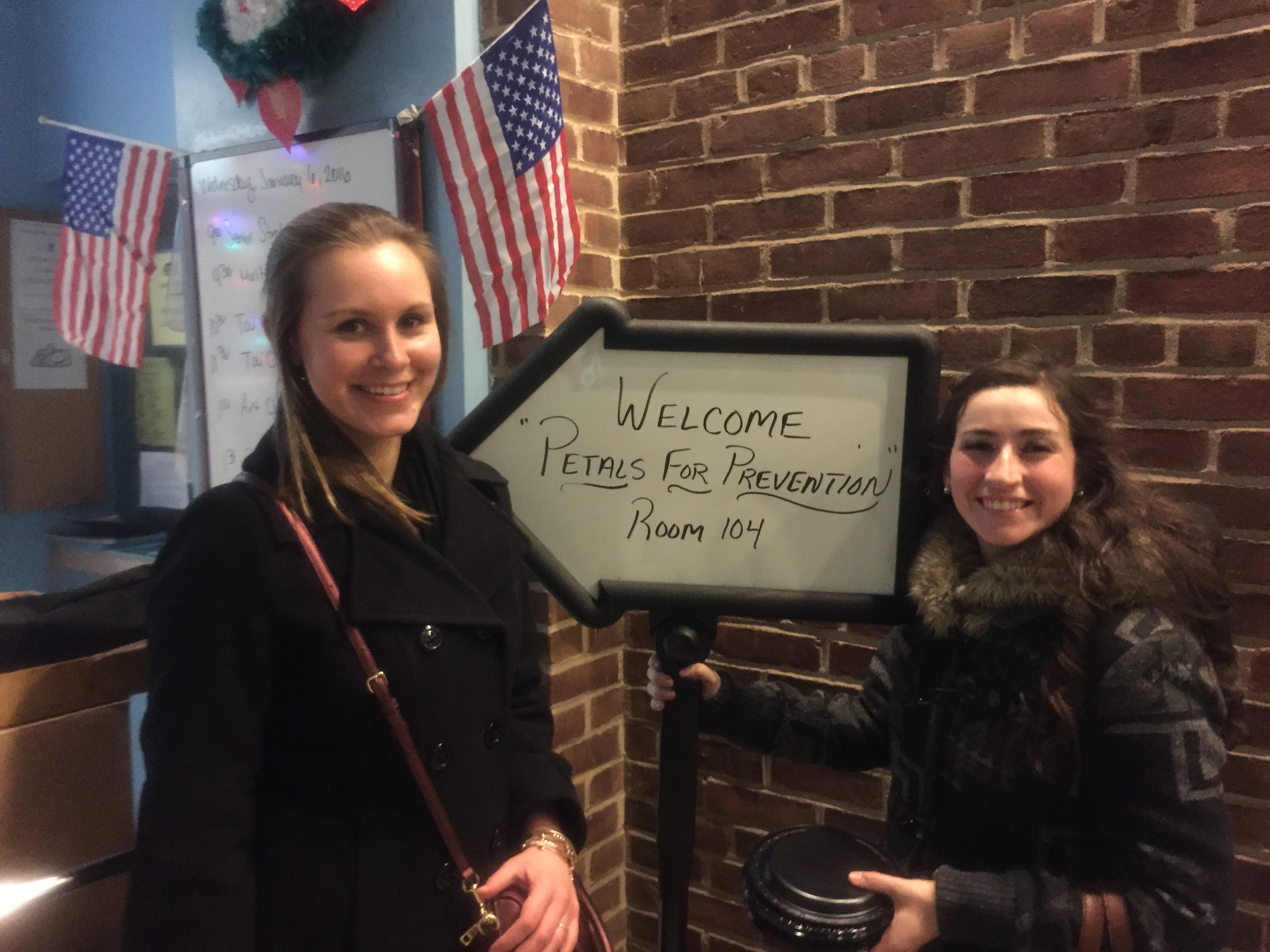 me and my friend with "pedals for prevention" sign