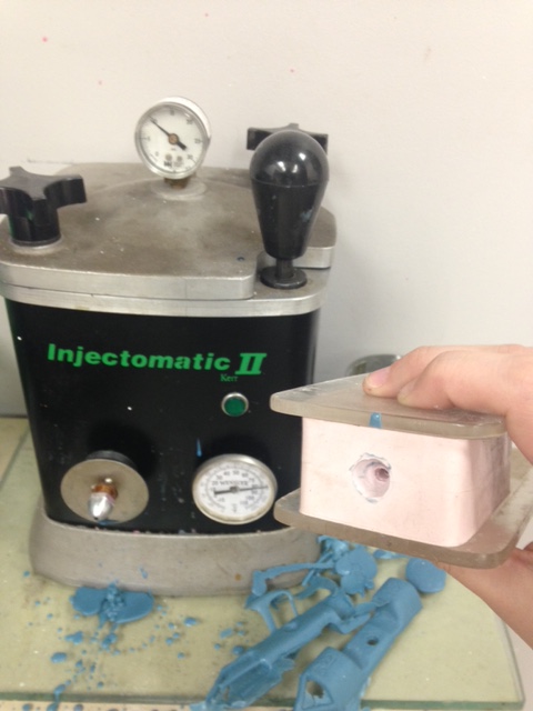 hot wax being shot into the rubber mold