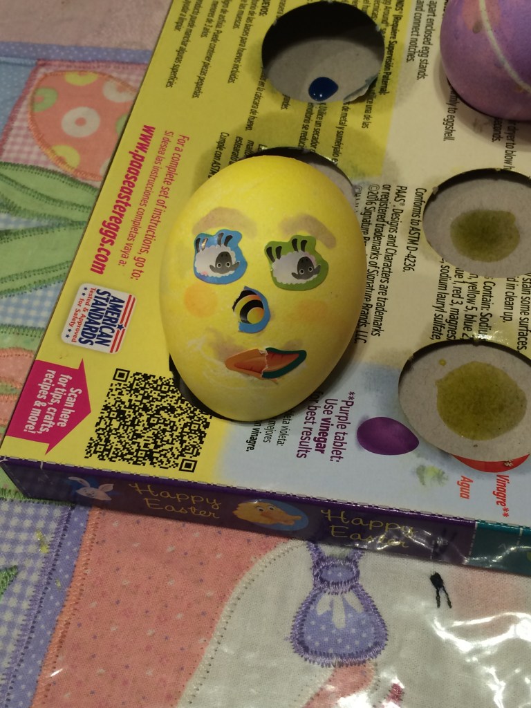 colored Easter egg with a face on it