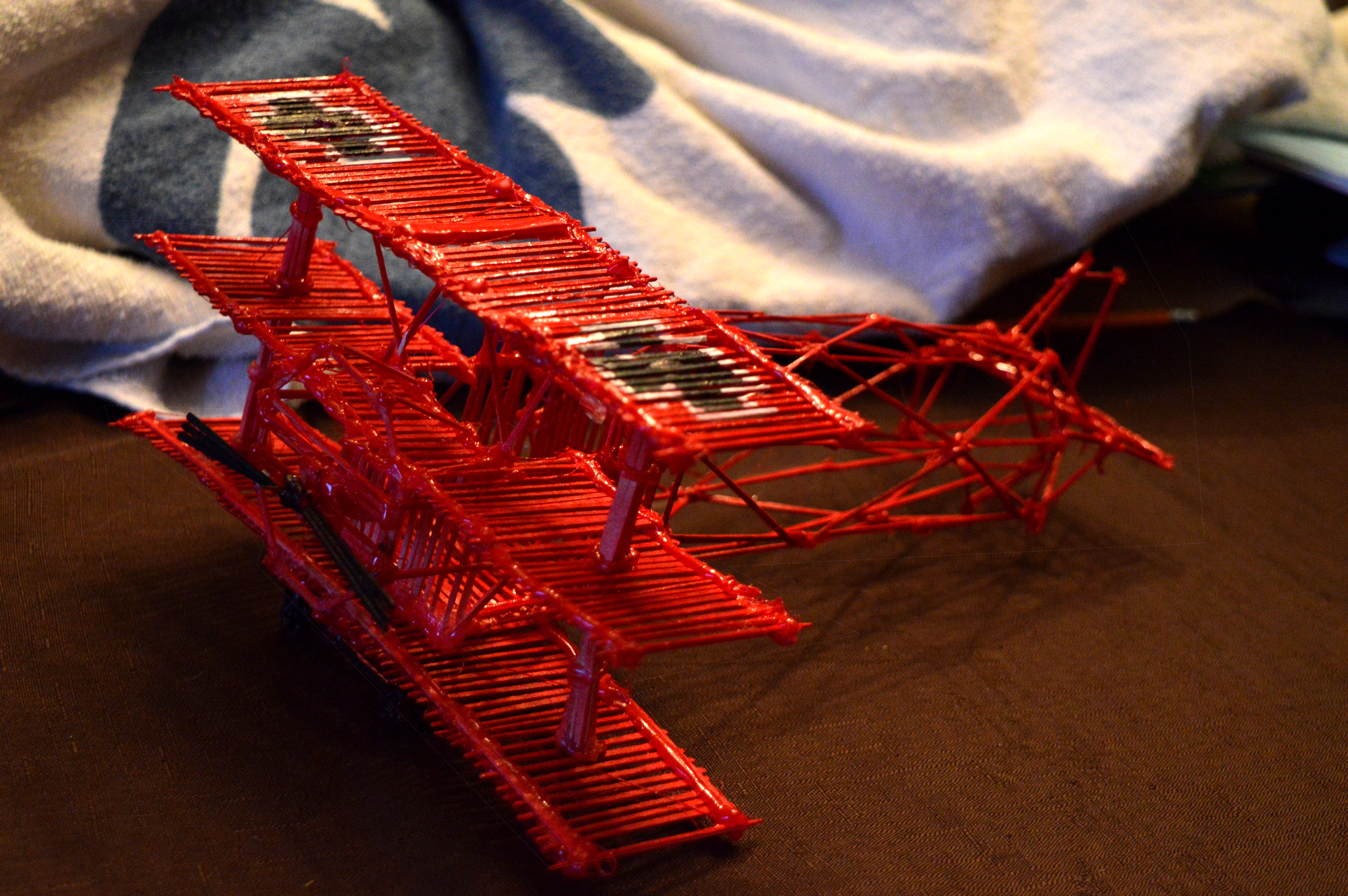 Toothpick structure. Red airplane