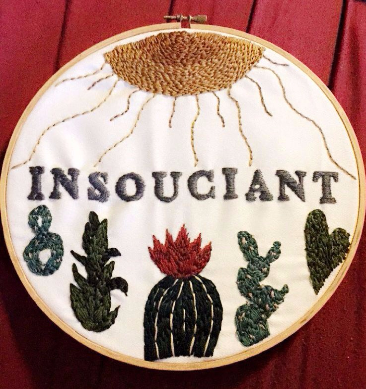 INSOUCIANT, sun with rays going down to cacti