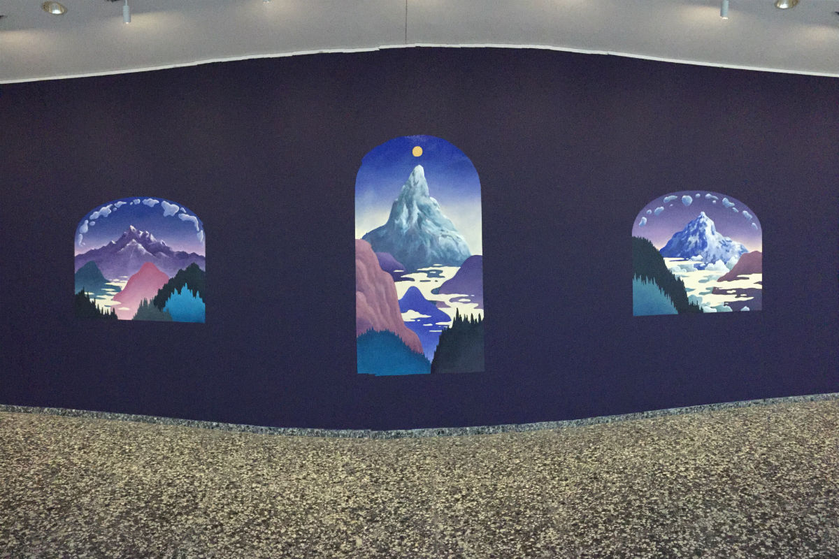 sunrises over mountains on purple wall