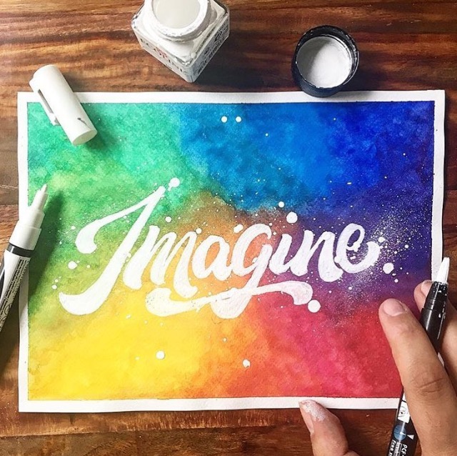 Imagine with rainbow watercolor background