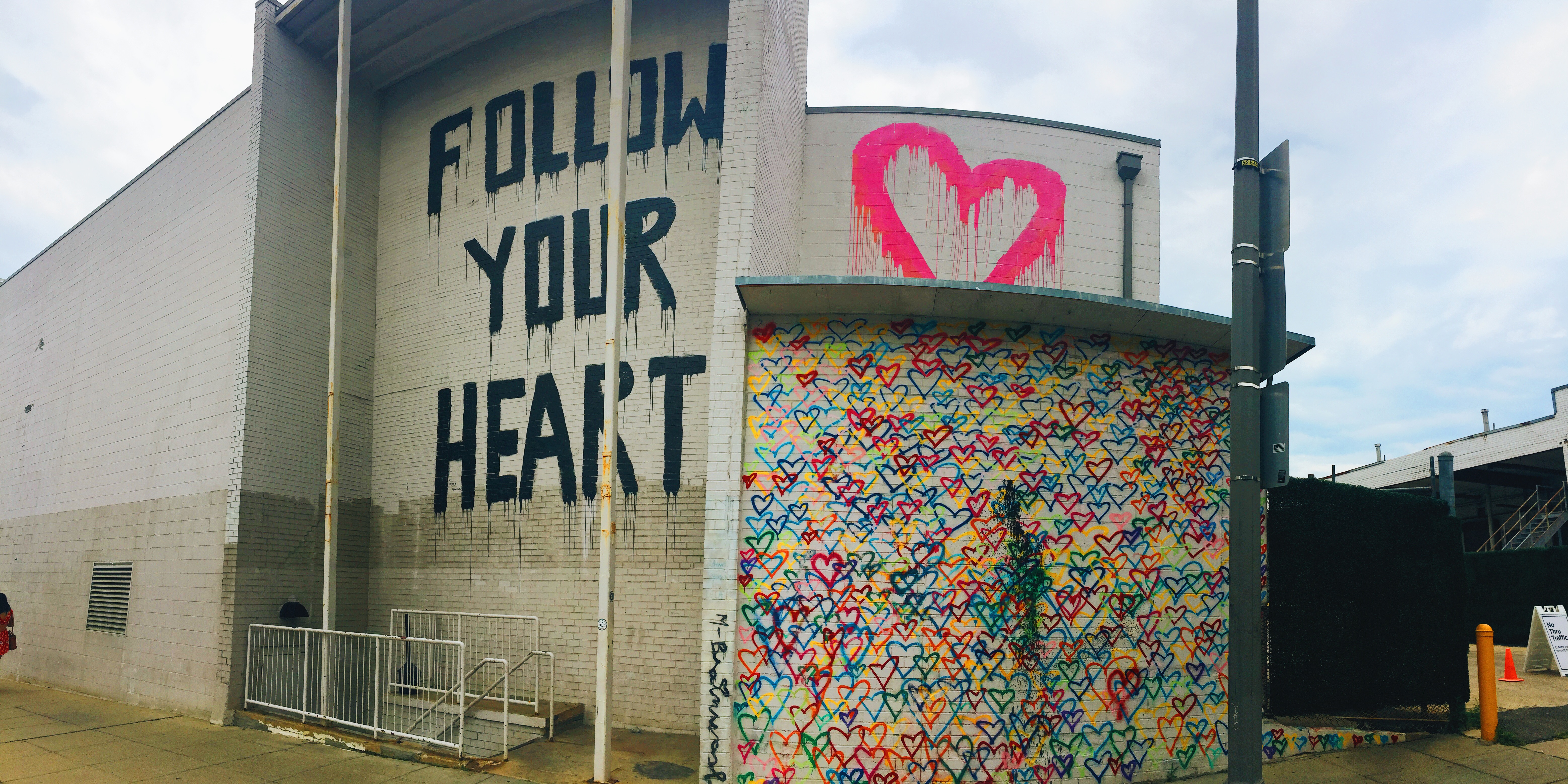 follow your heart and rainbow hearts mural