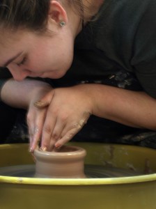 Me throwing clay on an electric wheel
