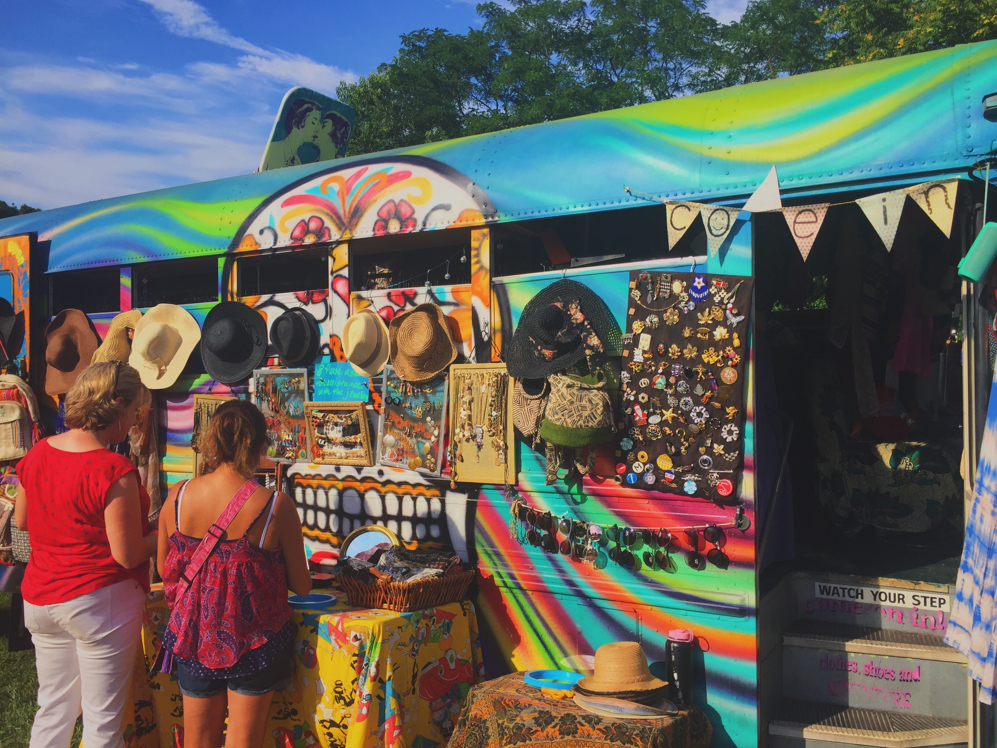 side of bus with sugar skull on it