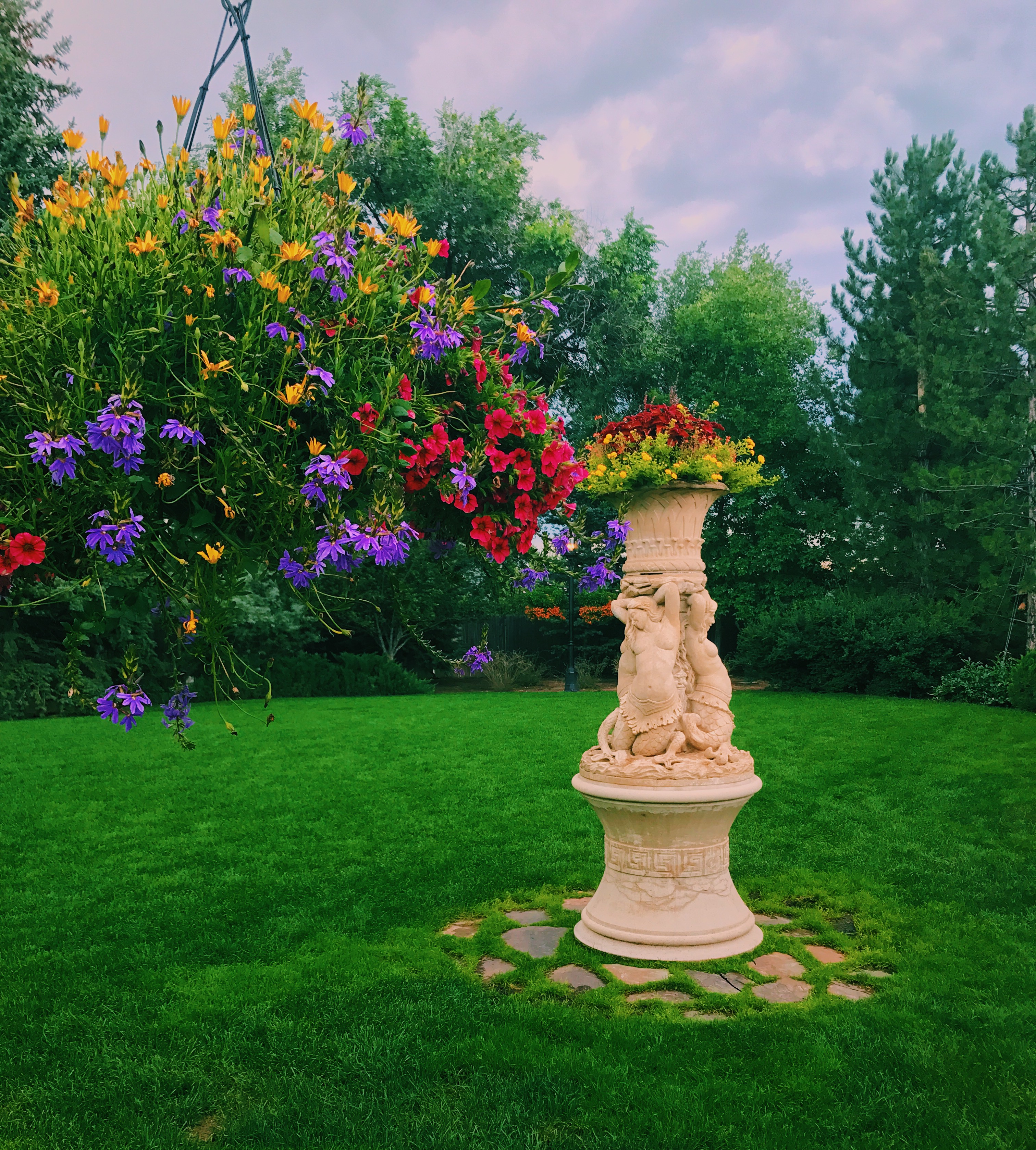 flowers with a statue