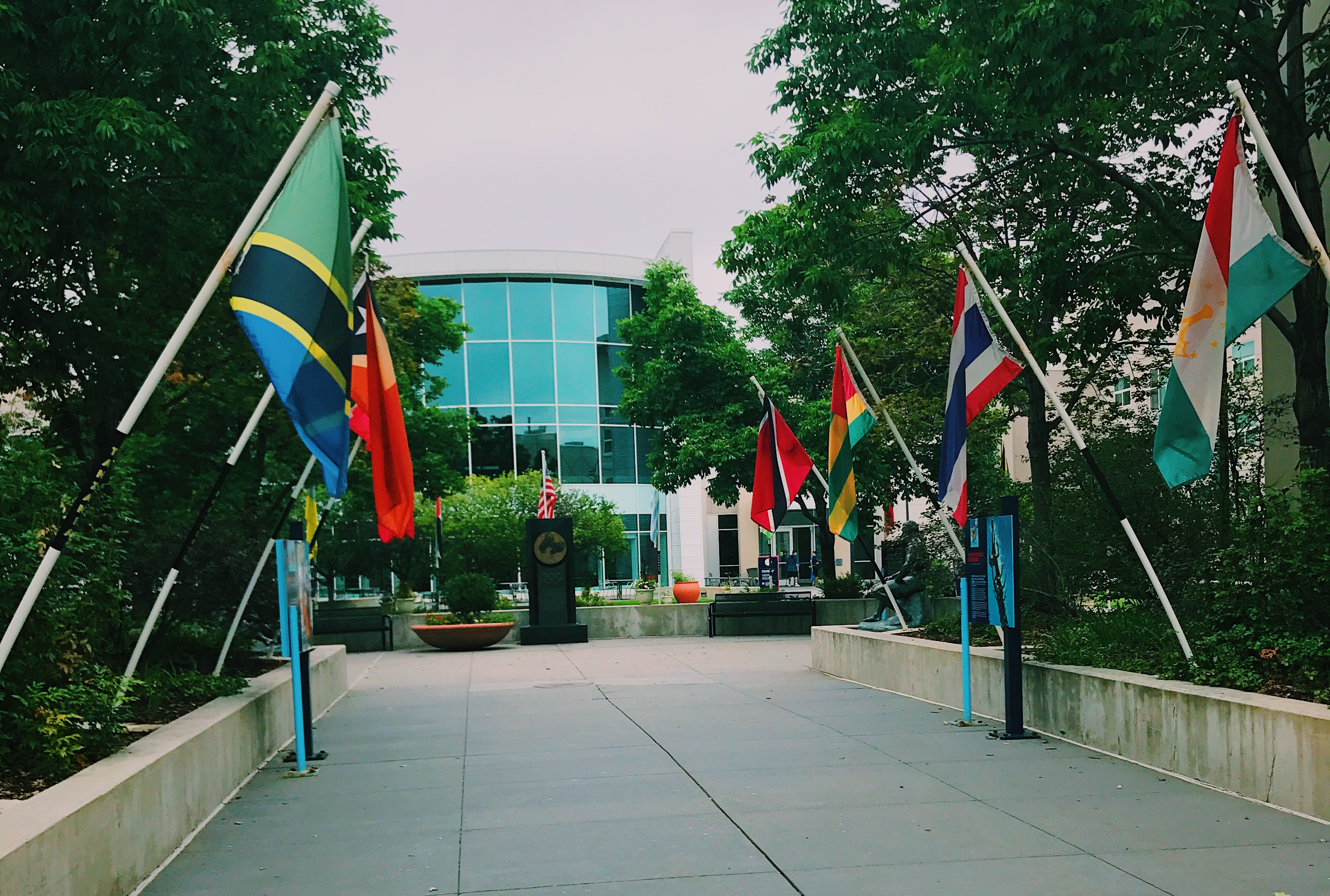 flags lined up in front of a building