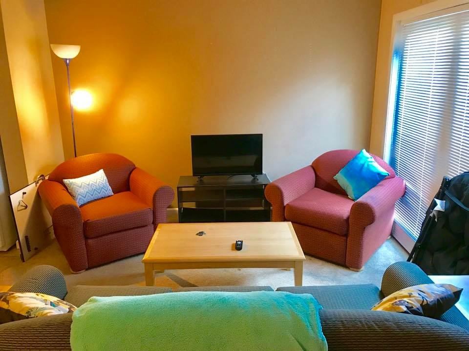 room with chairs and pillows