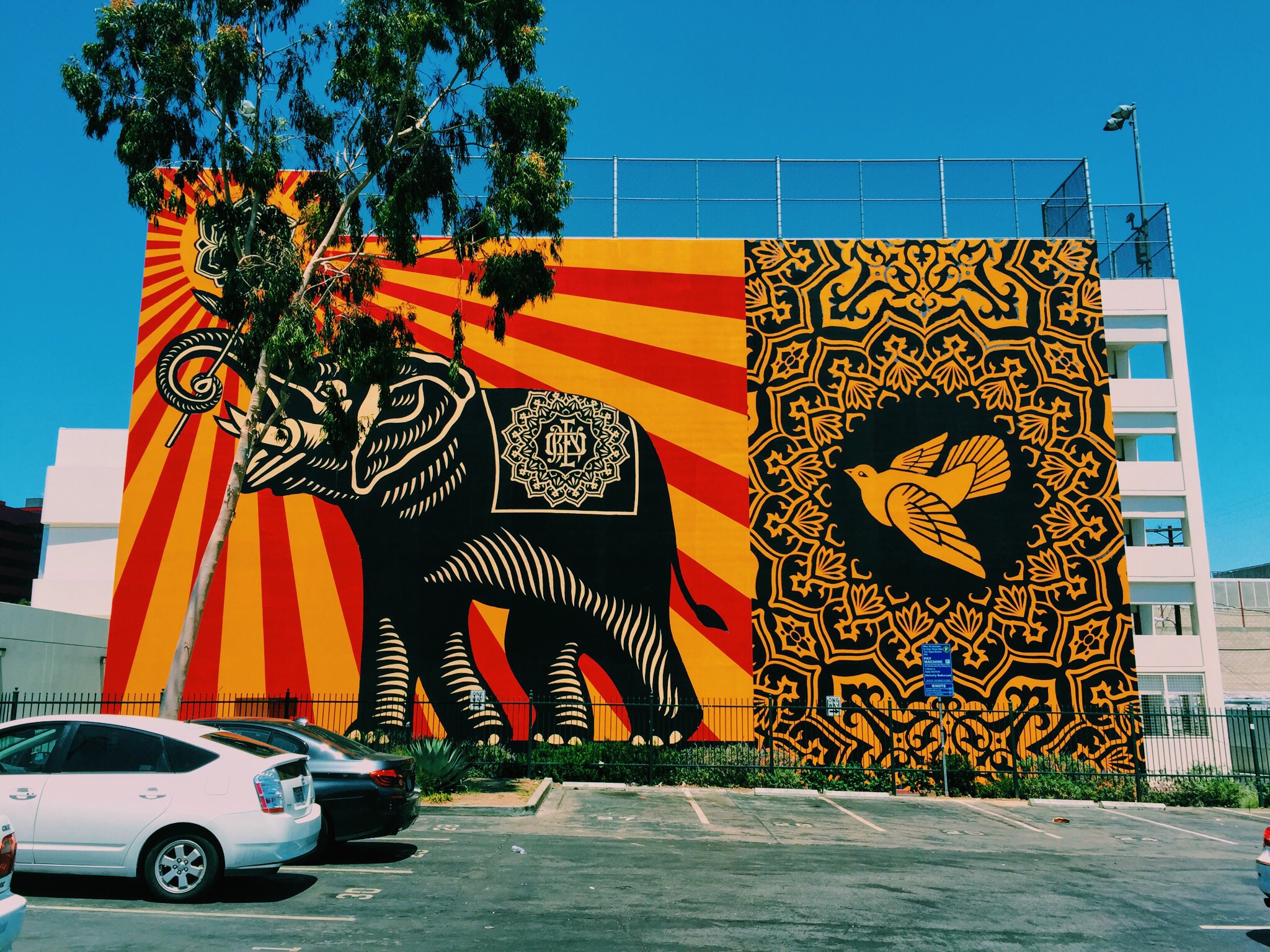 orange and red sun with elephant mural