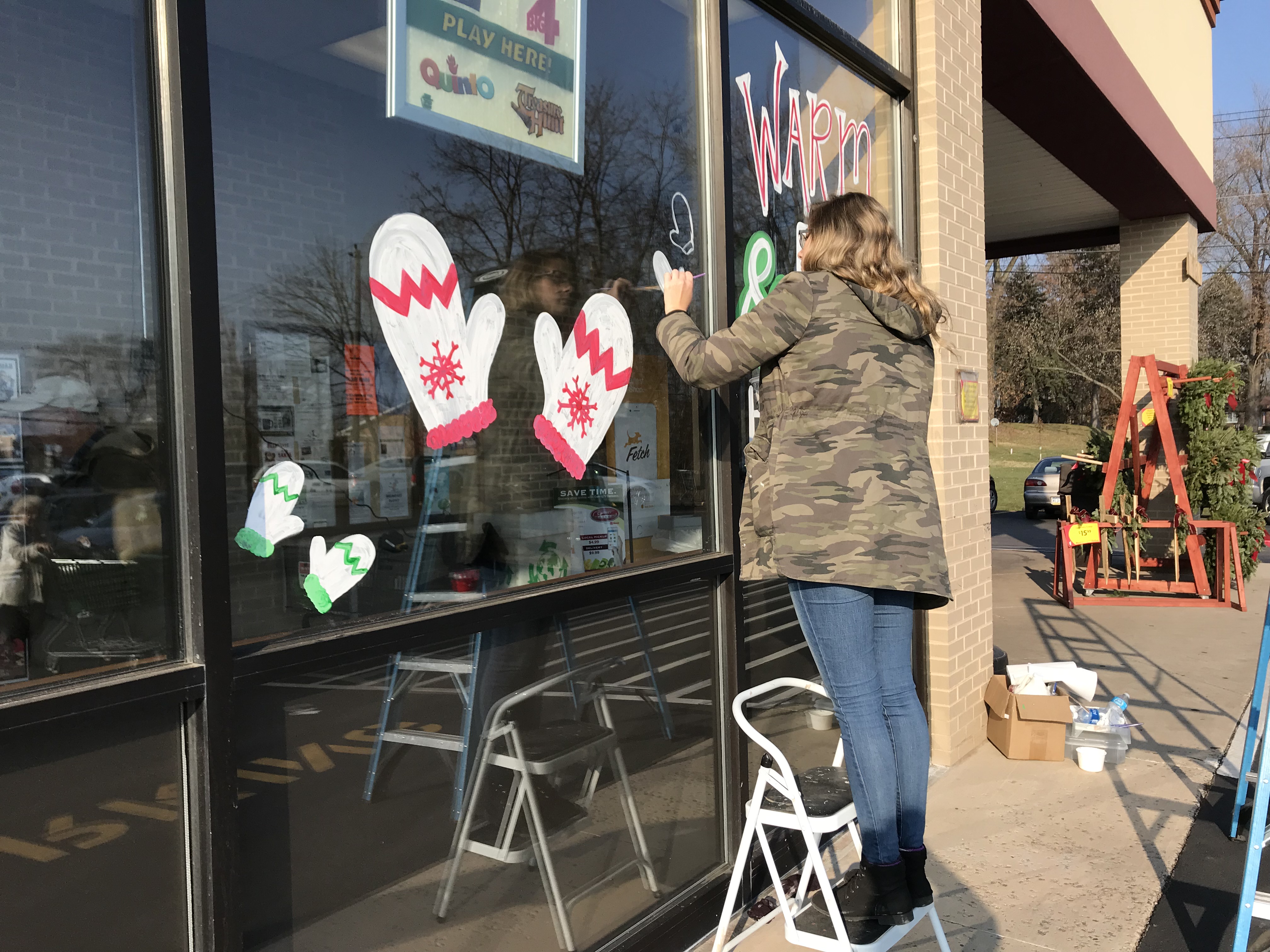 girl working on mittens design