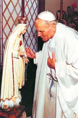 Saint Pope John Paul II with statue of Our Lady of Fatima