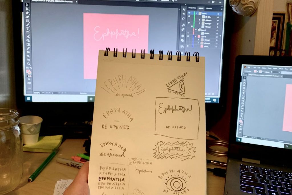 sketchbook with illustrator file open on screen