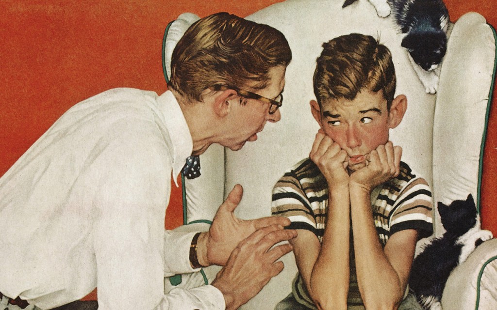 A man talking to a boy