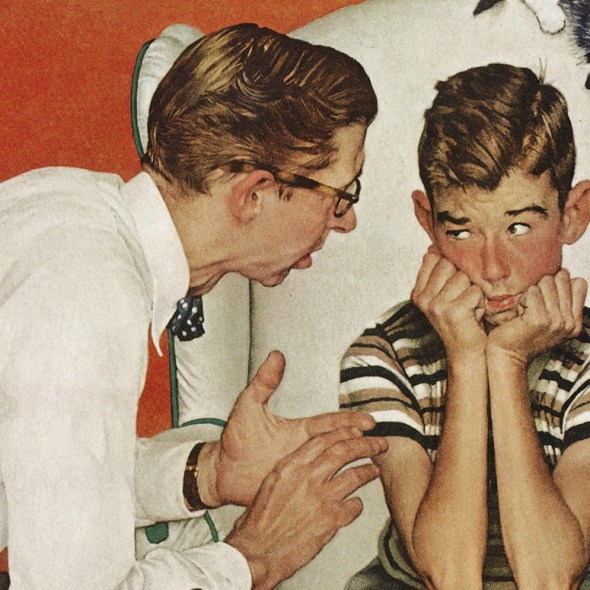 A man talking to a boy