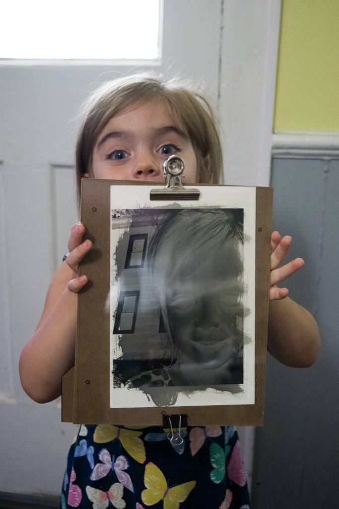 Violet holding exposed image