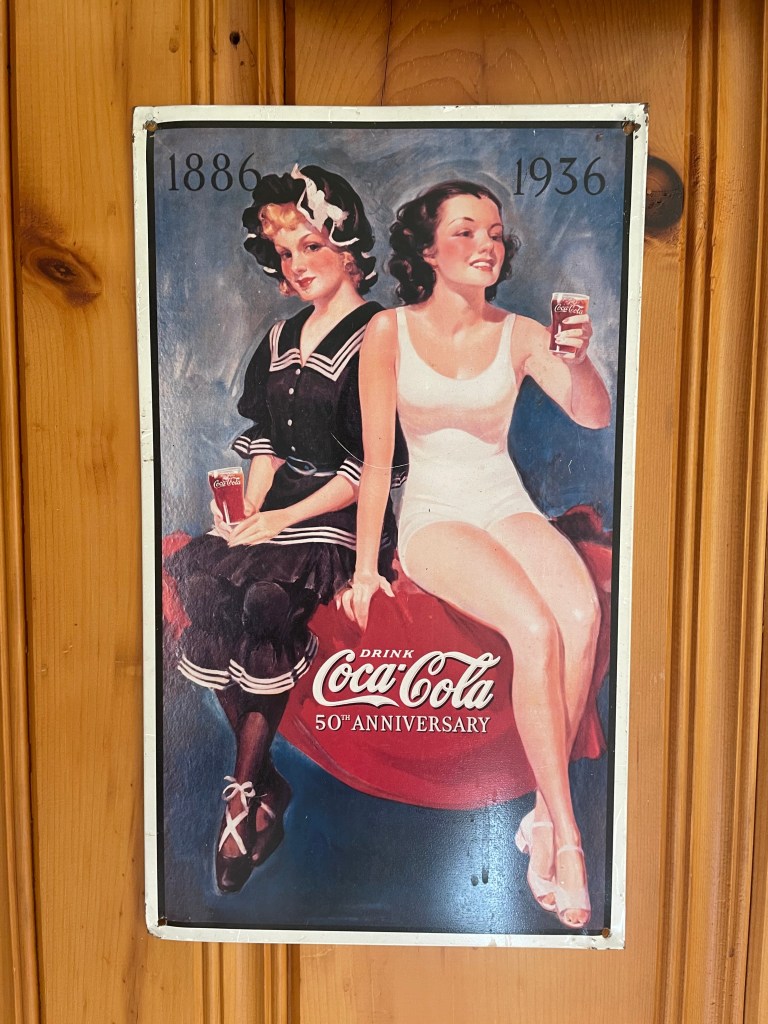 A pinup style advertisement hung in the Coca-Cola Room.