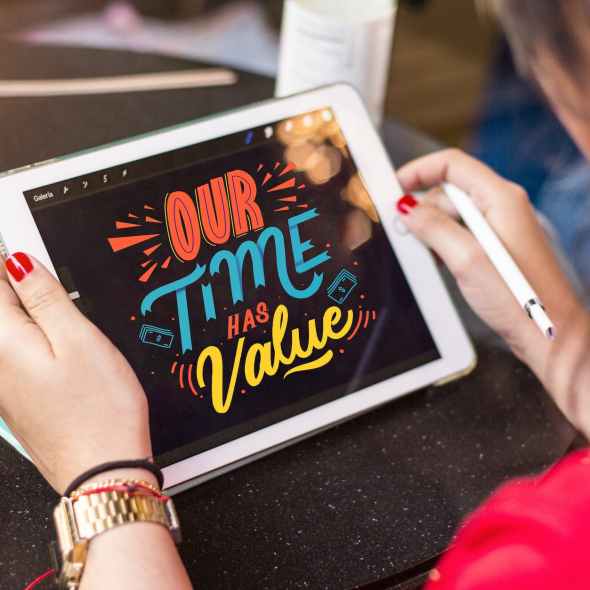 woman holding silver ipad