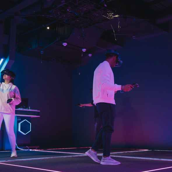 friends wearing vr headsets