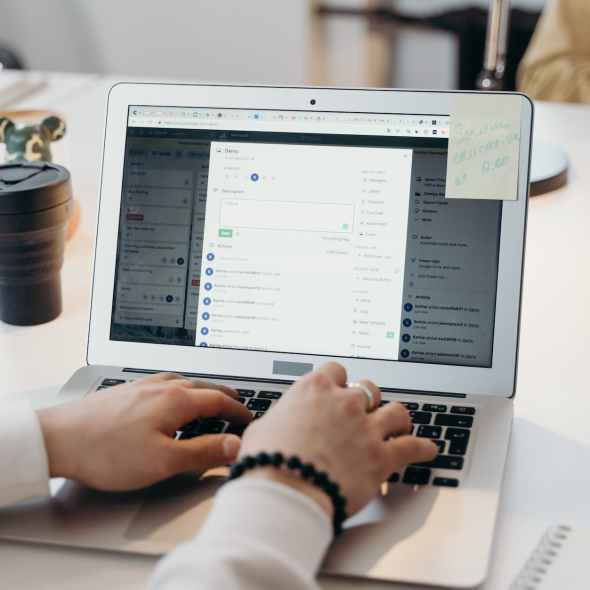 person using a laptop on a table