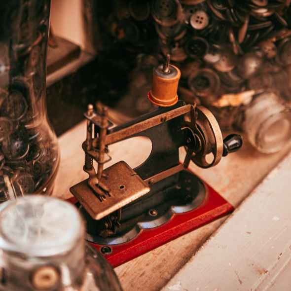 old sewing machine placed on table