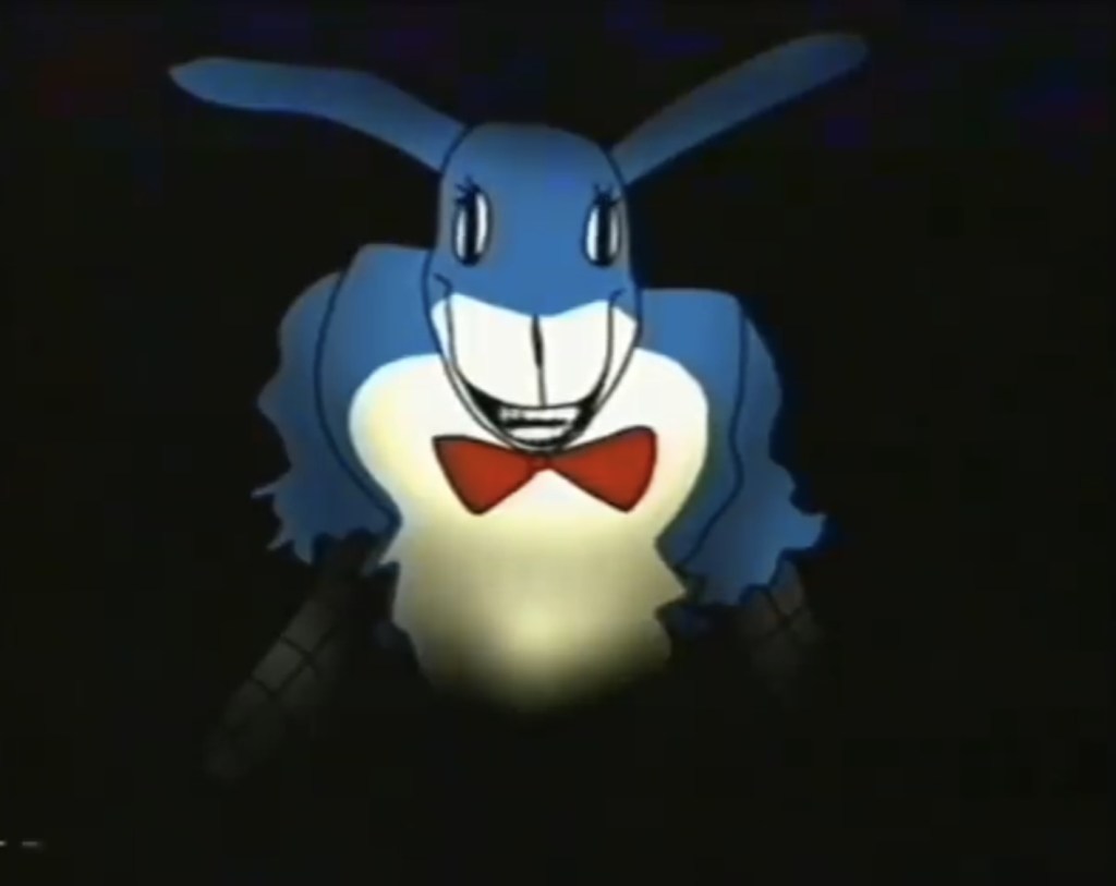 A disfigured, rabbit themed animatronic.