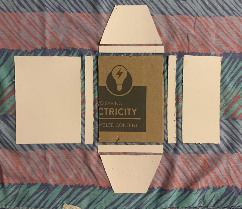 Cardboard template on-top of uncut fabric