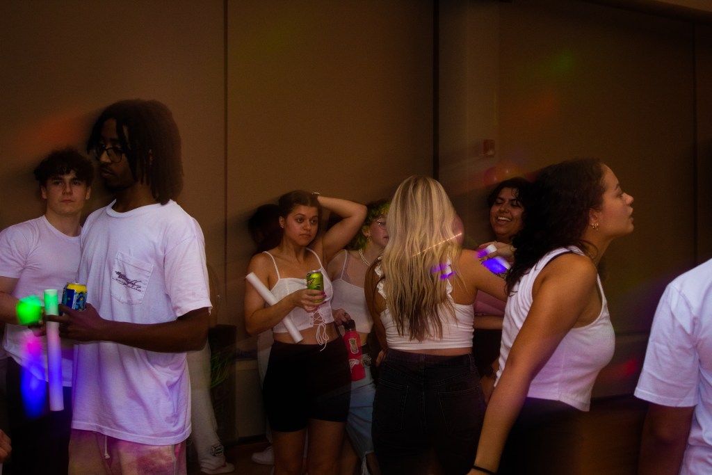 Crowd of dancing college students
