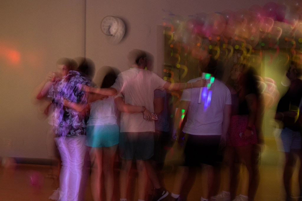 Crowd of dancing college students