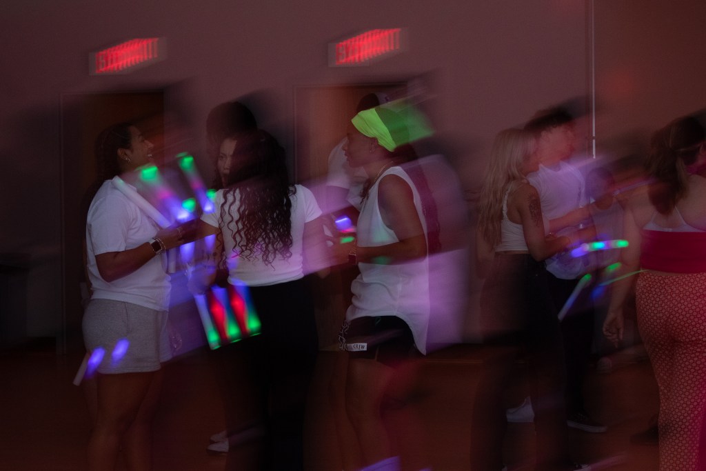 Crowd of dancing college students