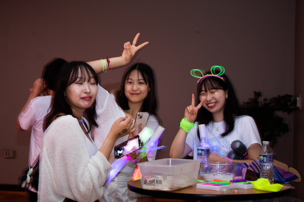 Three girls posing and smiling