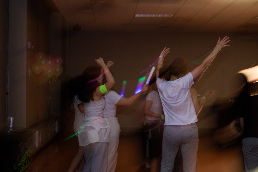 Crowd of dancing college students