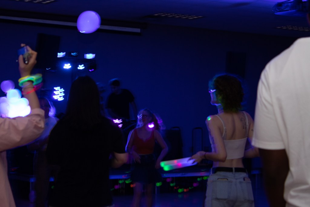 Crowd of dancing college students