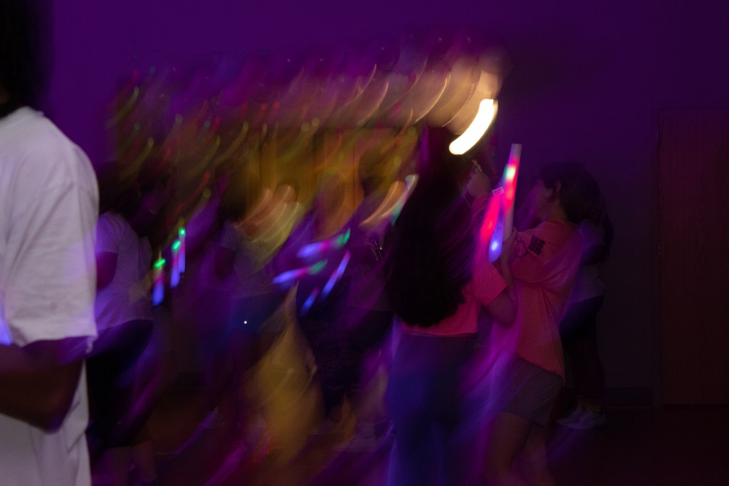 Crowd of dancing college students