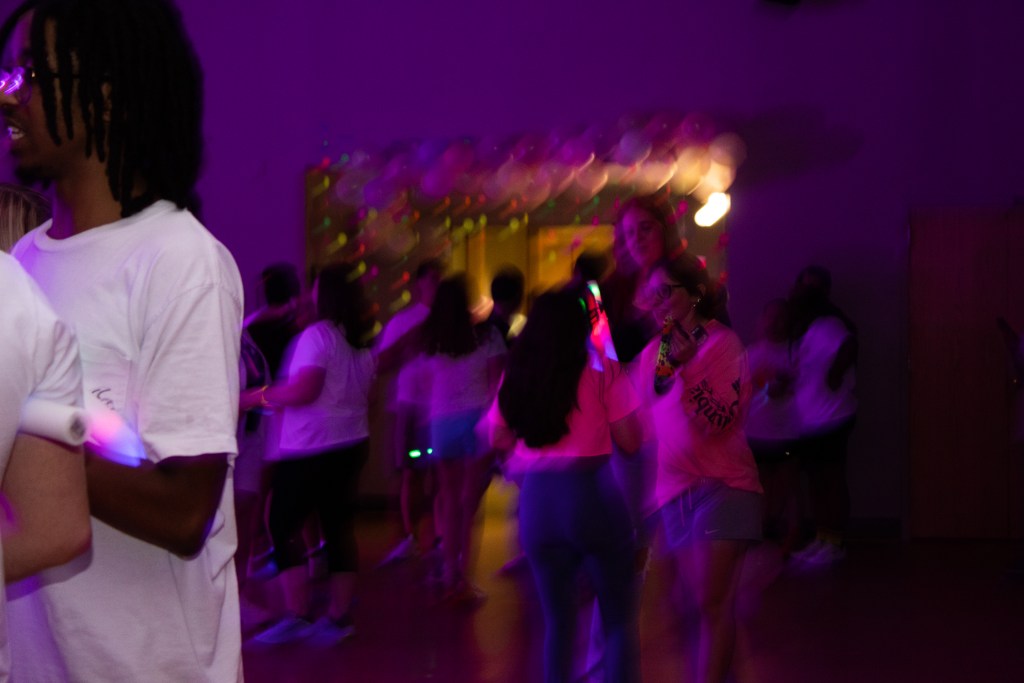 Crowd of dancing college students