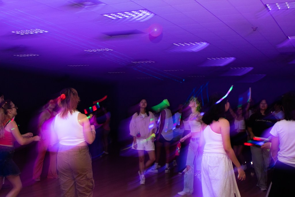 Crowd of dancing college students