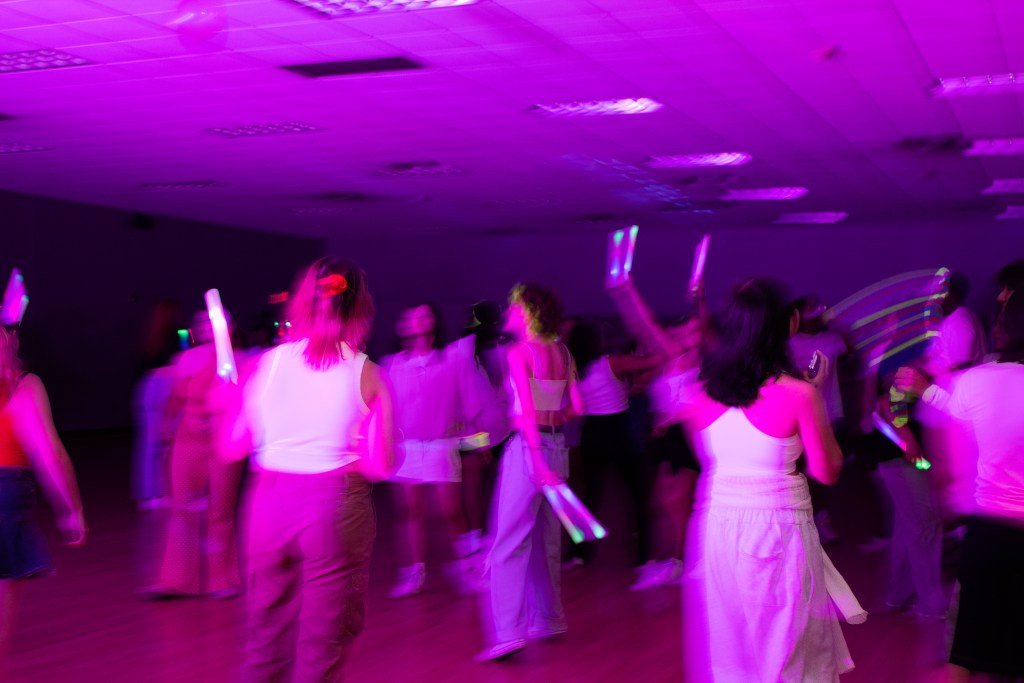Crowd of dancing college students