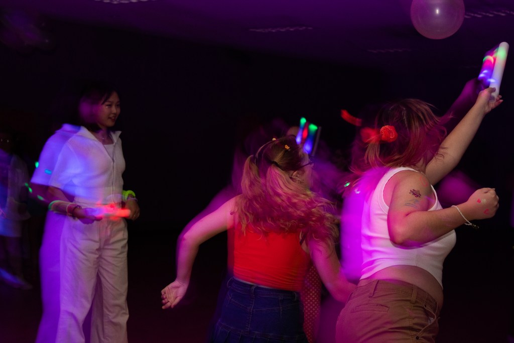 Crowd of dancing college students