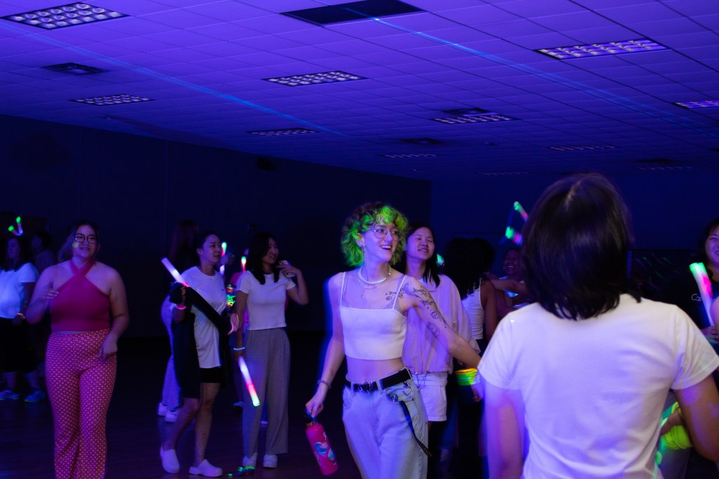 Crowd of dancing college students