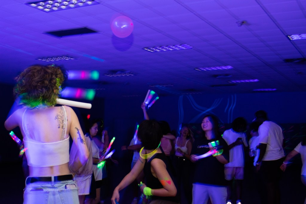 Crowd of dancing college students