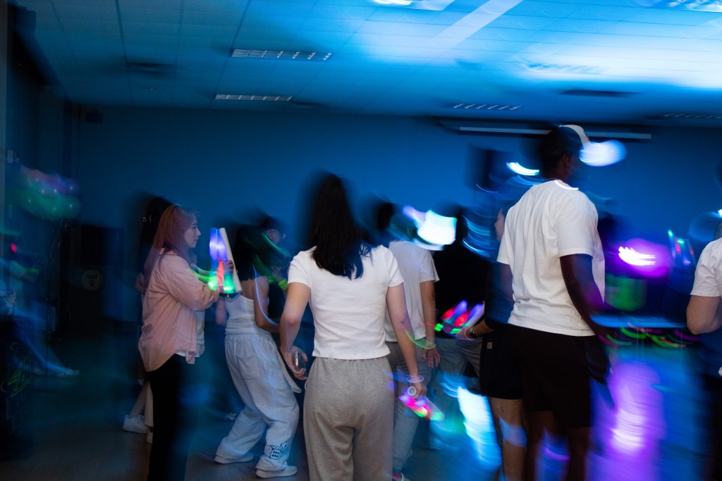 Crowd of dancing college students