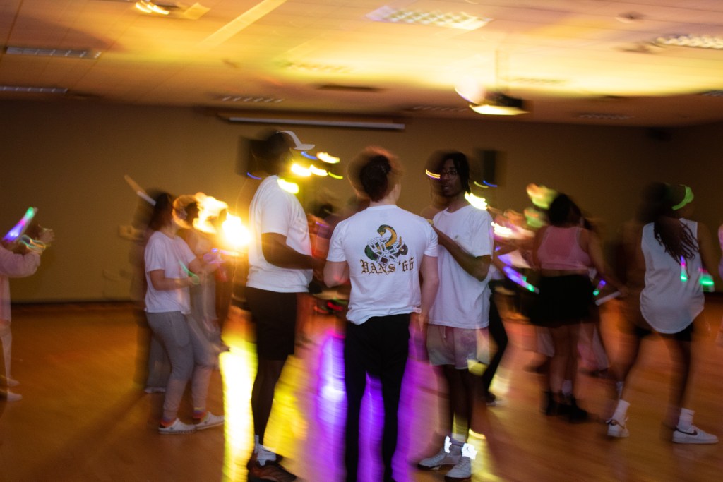 Crowd of dancing college students
